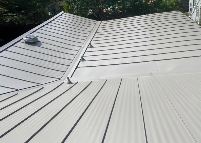 Solar attic fan installed on a metal roof for Roof Ventilation in Rincon Valley